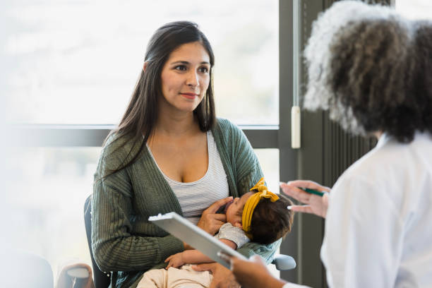 Mother with baby & nurse in cozy home
